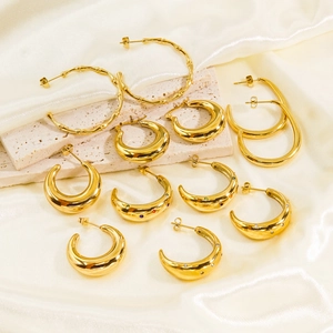 Polished gold stainless steel C-shaped hoop earrings collection with sparkling cubic zirconia