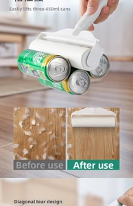 Detail showing strong adhesive lint roller lifting three heavy cans on wood floor