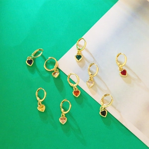 Detailed top view of multi-colored heart-shaped zircon earrings with gold hoops