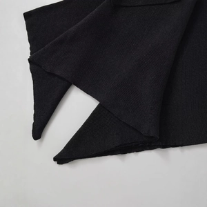 Women's asymmetric wool poncho coat in black fine rib knit with vertical stripe texture