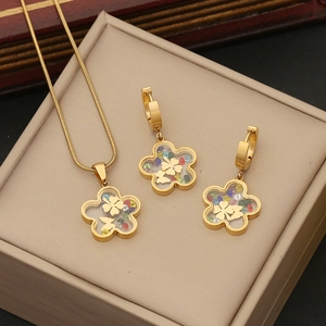 Golden flower glass pendant necklace and earrings set with colorful gems and butterflies