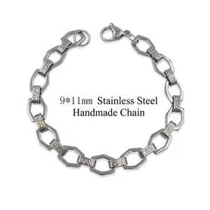 Polished stainless steel chain bracelet featuring Greek key pattern links and lobster clasp