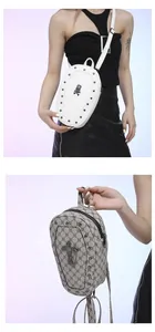 Detail of gothic small cross bags with skull motifs and rivet accents on textured leather