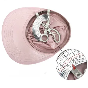 Pink sun visor detail showing adjustable 56-65 cm cap circumference measurement