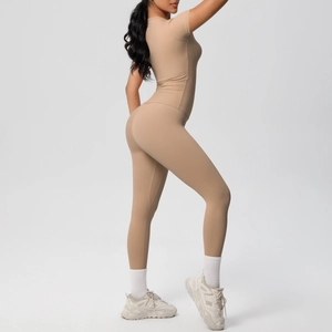 Detail view of khaki two-piece workout set featuring high-waist leggings and short sleeve top