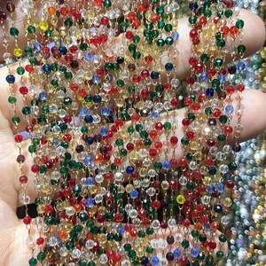 Macro shot of colorful faceted crystal beads on a thin chain for DIY jewelry making