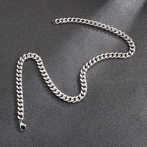 Detailed view of silver titanium steel curb chain necklace with secure lobster clasp