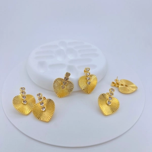 Retro gold heart drop earrings with embossed sunburst pattern and clear zircon stones