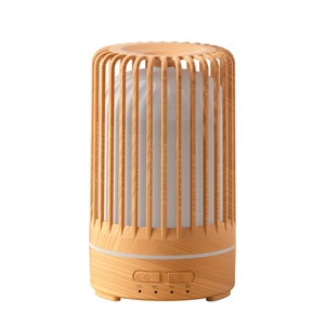Birdcage aromatherapy humidifier with wood grain finish and timer settings on white background