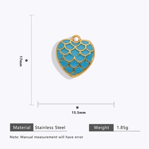 Detailed view of sky blue enamel heart pendant with gold stainless steel edges
