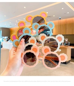Detailed view of colorful bear-ear sunglasses for kids in various soft pastel colors