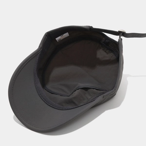 Detail of dark grey flat top military cap showing breathable lining and adjustable strap