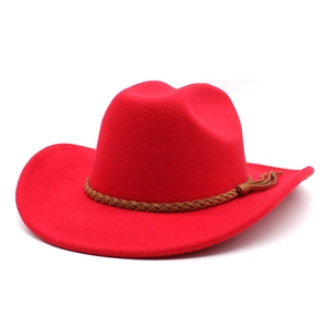 Detail of red fedora hat featuring a brown braided leather band and wool-like texture