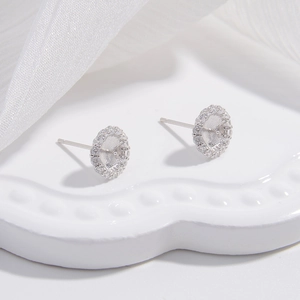 Detail of S925 silver sunflower pearl stud earrings settings with sparkling zircon stones