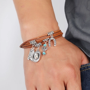 Men's layered brown leather bracelet featuring silver western charms with a cowboy theme