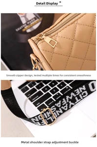 Detail of light brown quilted bag with gold zipper and adjustable lettered wide strap