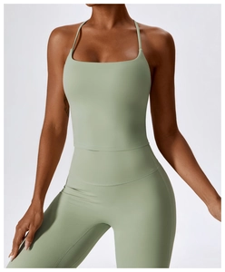 Close-up of light sage green yoga vest set with thin straps and square neck