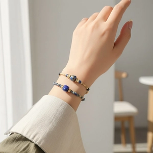Close-up of bohemian blue sodalite beaded double-layer bracelet worn on a female wrist