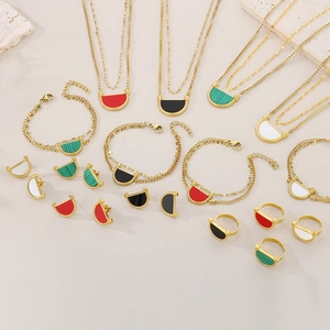 Detailed set of gold titanium steel jewelry with colorful semi-circle acrylic inlays