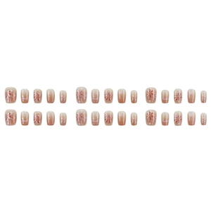 Pink gradient press-on nails with fireworks and star designs in a glossy 30-piece set