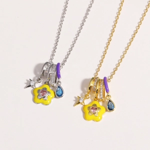 Detailed view of colorful enamel necklaces with heart-shaped gems and star charms