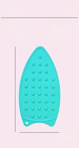 Detail view of mint green silicone iron rest pad with anti-slip bumps and dimensions