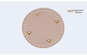 Macro view of 15cm khaki round bucket bag base with pre-drilled holes and gold studs