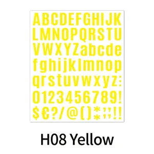 Macro view of yellow adhesive vinyl alphabet and number stickers for DIY crafts