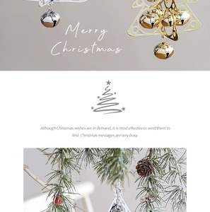 Detail showing gold and silver Christmas tree bell pendants on green pine branches