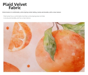 Macro detail of soft plaid velvet fabric featuring vivid orange fruit pattern prints