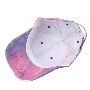 Detail of internal 100% cotton lining and metal adjustable buckle on tie-dye baseball cap