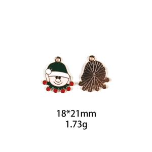 Macro view showing dimensions of a metal Santa Claus charm for DIY crafts and jewelry