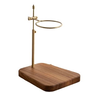 Adjustable solid wood and brass pour over coffee dripper stand on white background