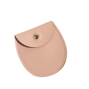 Pink round bottom PU leather jewelry pouch with gold snap button and debossed logo