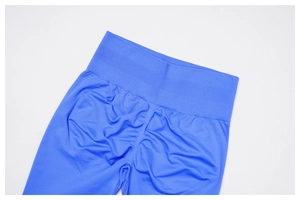 Detail of blue high-waisted seamless yoga shorts with scrunch butt lifting texture