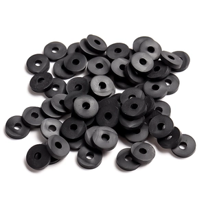 Macro shot of 6mm black polymer clay spacer beads for DIY jewelry making and crafts
