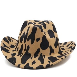 Close-up of thick felt cow print cowboy hat showing stitched brim and khaki pattern