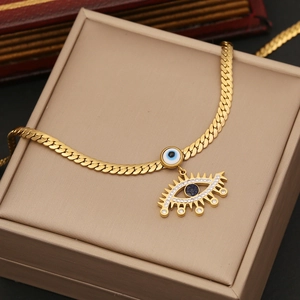 Golden stainless steel flat chain necklace with turquoise evil eye pendant in jewelry box