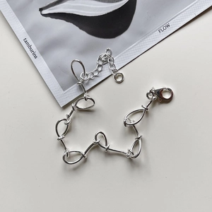 Detail of S925 sterling silver woven link bracelet with lobster clasp and adjustable chain
