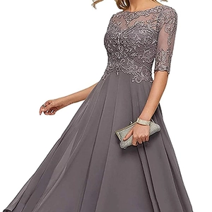 Elegant grey lace evening dress with long chiffon pleated skirt and silver clutch bag