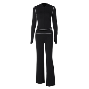 Detail of black hooded zip-up tracksuit with white contrast stitching and thumbhole cuffs