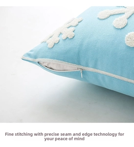 Detail of hidden zipper and fine stitching on blue Christmas snowflake embroidered pillowcase