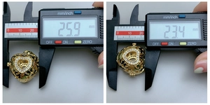 Measurements of heart-shaped gold locket pendant showing width 25.9mm and height 23.4mm