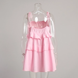 Detail of pink tiered ruffle dress with adjustable spaghetti straps and layered fabric