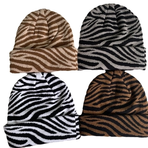 Winter knitted beanies in zebra animal patterns featuring brown, gray, and white styles