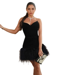 Elegant black strapless velvet mini dress with luxury feather hem for party wear