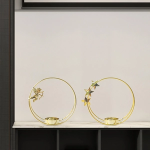 Modern Nordic golden iron ring candle holder with angel and star ornaments on marble