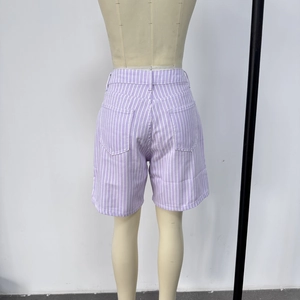 Detail view of purple vertical striped high-waisted shorts with rear pockets and loose fit