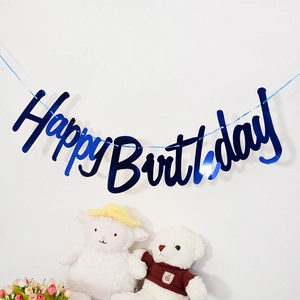 Close-up of blue metallic Happy Birthday bunting banner for boy birthday party decor