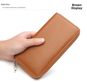 Close-up of brown litchi pattern leather wallet with premium silver metal zipper